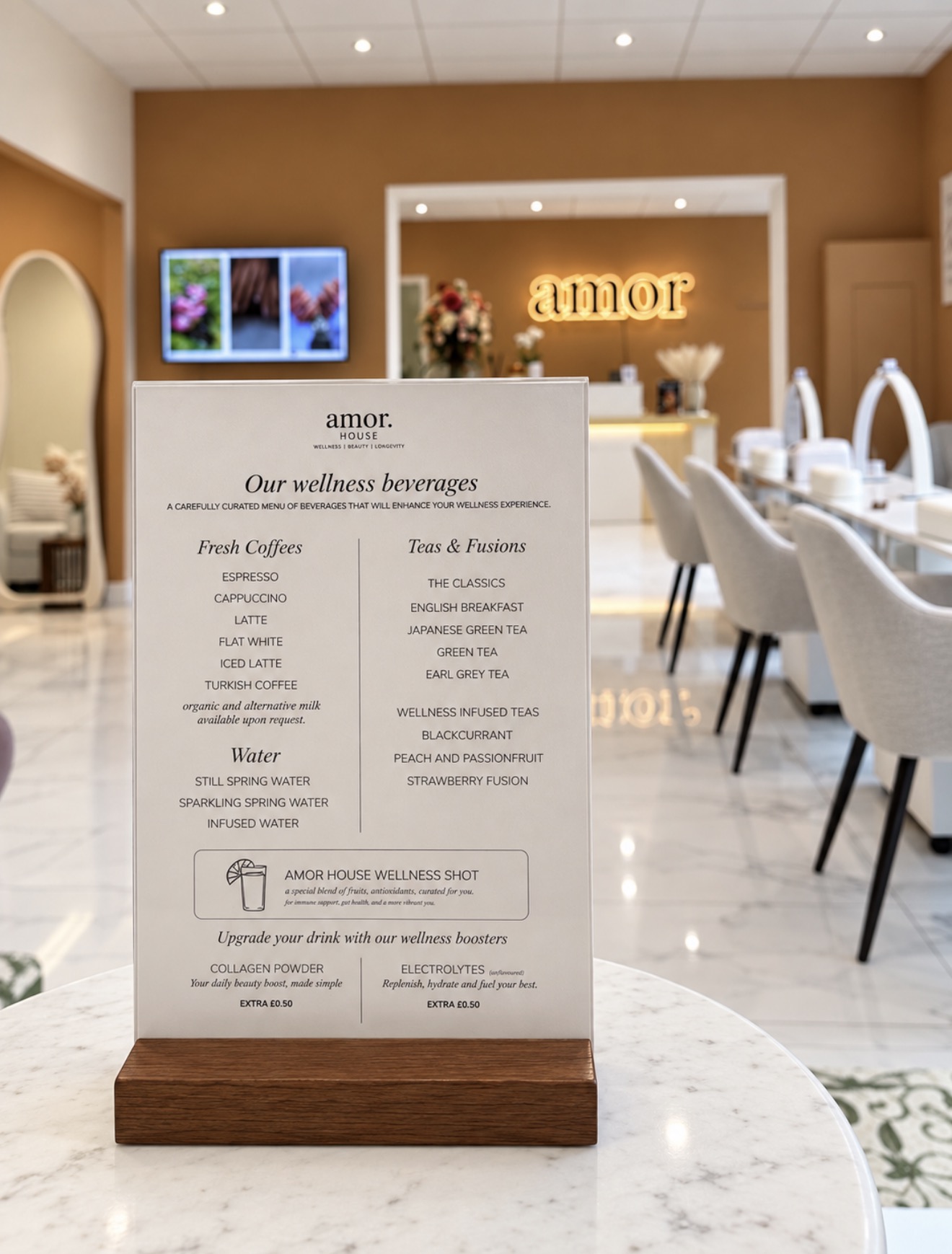 Amor House wellness drinks menu with the clinic reception beyond